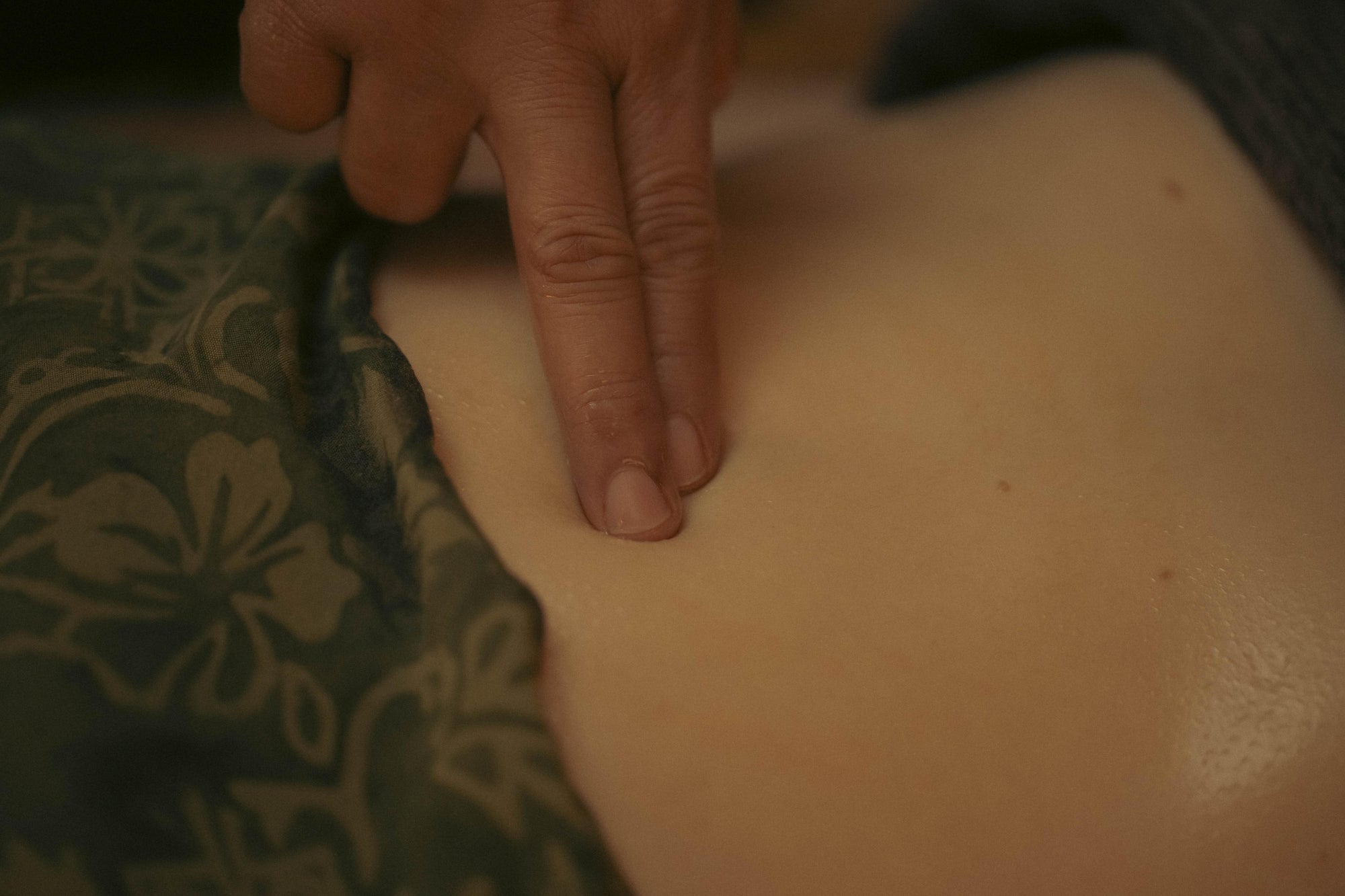 Pressure applied to stimulate and unblock marma point during massage